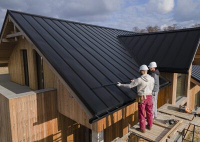 full-shot-roofers-working-together-with-helmets